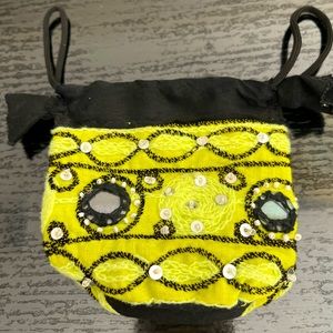 Coin purse with mirrors and sequins.